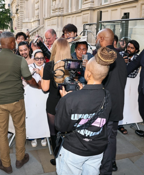 Mariah Carey stuns in chic black playsuit as she greets fans outside London Hotel