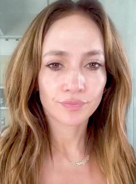 Jennifer Lopez went makeup-free  dancing to her own music and applying products from JLo Beauty to her face