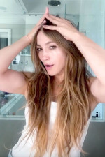 Jennifer Lopez went makeup-free  dancing to her own music and applying products from JLo Beauty to her face