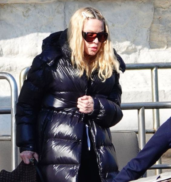 'The Queen Of Pop' Madonna is seen out in Venice where the star donned her black puffer jacket and holding her Louis Vuitton hat.