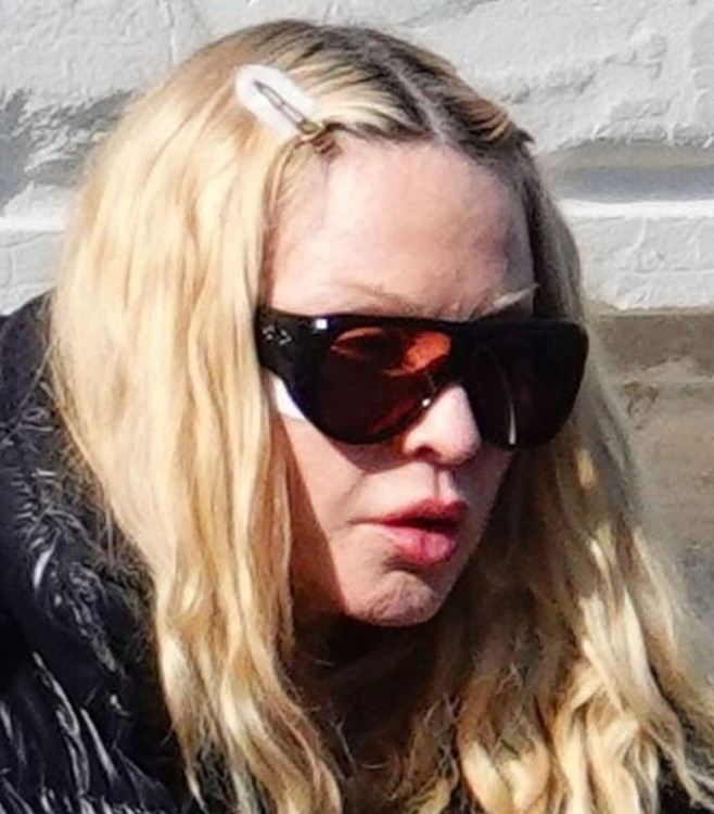 'The Queen Of Pop' Madonna is seen out in Venice where the star donned her black puffer jacket and holding her Louis Vuitton hat.