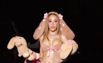Doja Cat wears a bold plush bunny costume to her doll-themed birthday party