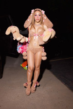 Doja Cat wears a bold plush bunny costume to her doll-themed birthday party