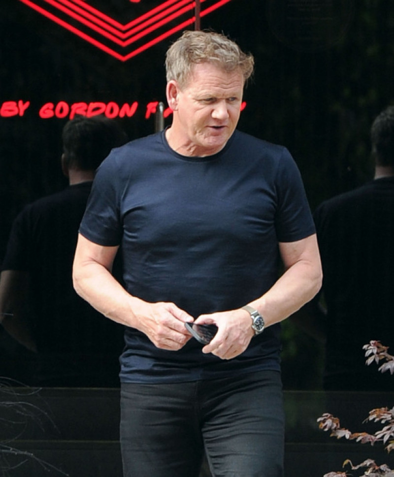 *EXCLUSIVE* British celebrity chef Gordon Ramsay pictured showing his toned physique in a black t-shirt while seen leaving his Lucky Cat restaurant with a mystery lady friend and getting into his awaiting chauffeur-driven Range Rover!