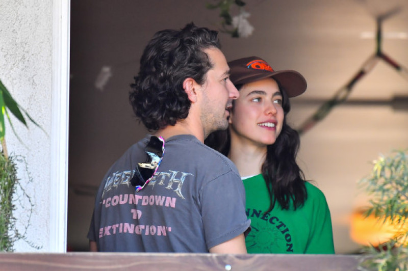 EXCLUSIVE: Margaret Qualley looks lovingly at her boyfriend Shia LaBeouf as they stop by a friend's house in Studio City