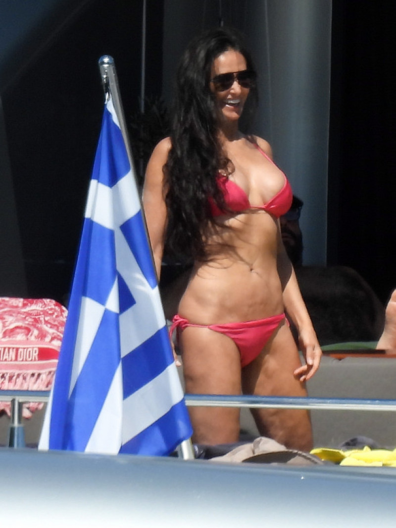 EXCLUSIVE: ** EMBARGO: strictly no web before 18:45 BST (13.45 ET) 16 Aug 2022. ** G.I. Jaw Dropping! Demi Moore Looks Sensational At 59 In A Red Bikini On Vacation In Greece