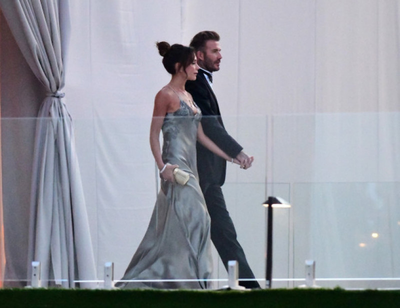 David Beckham and his wife Victoria Beckham enter the dinner tent after their son Brooklyn married Nicola Peltz in Palm Beach