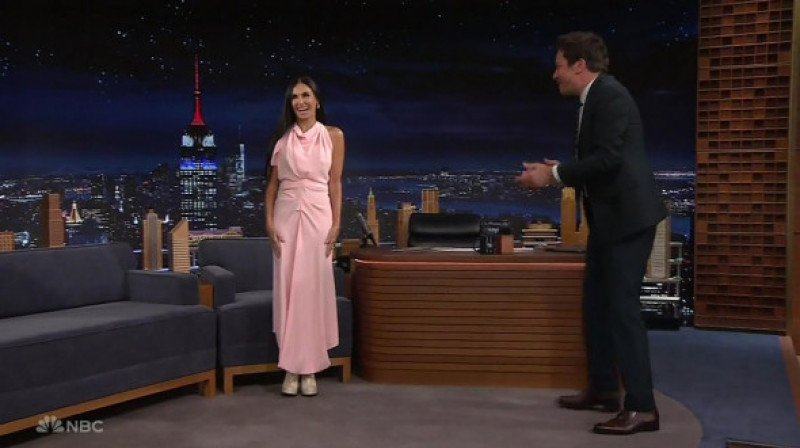 Demi Moore jokes that she’s single because she sleeps with her dogs every night, as she appears on The Tonight Show