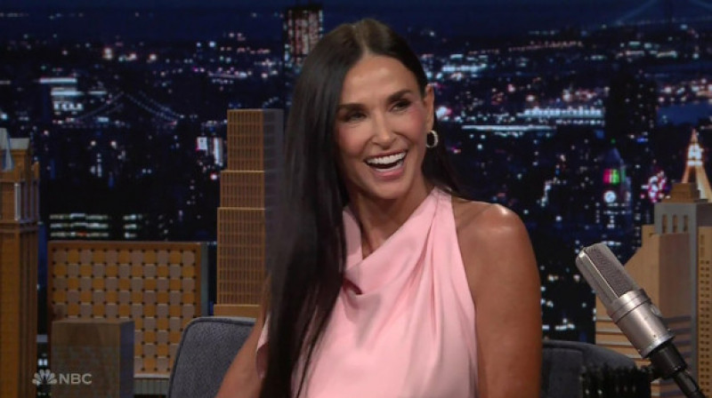 Demi Moore jokes that she’s single because she sleeps with her dogs every night, as she appears on The Tonight Show