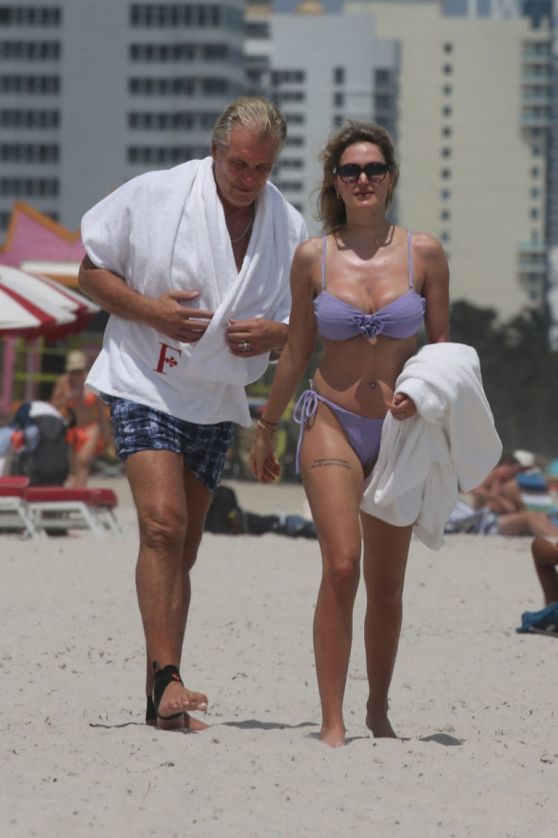 EXCLUSIVE: Dolph Lundgren, 67, is seen with his 29-year-old bikini-clad wife as they hit the beach in Miami