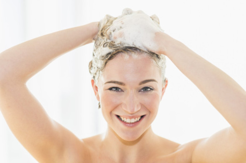 Beautiful woman washing hair