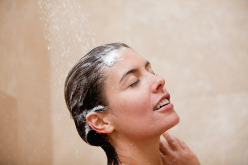Woman washing her hair in the shower
