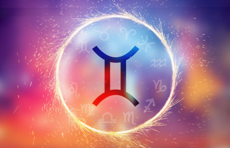 Gemini symbol on a colorful background light