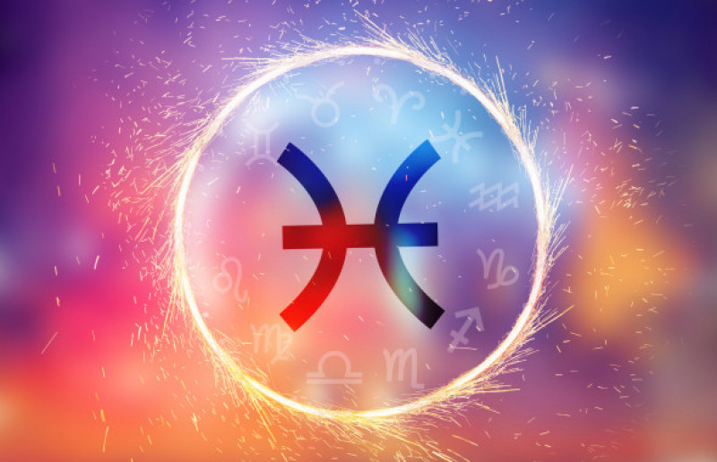 Pisces symbol on a colorful background light