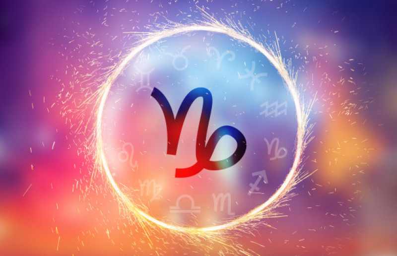 Capricorn symbol on a colorful background light