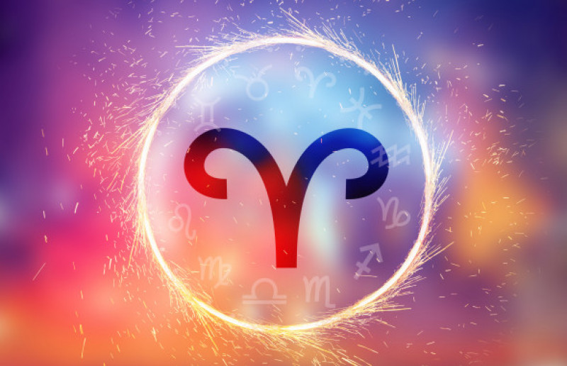 Aries symbol on a colorful background light