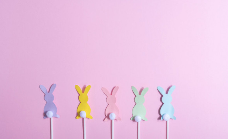 Colorful easter bunnies flat Lay on pink background