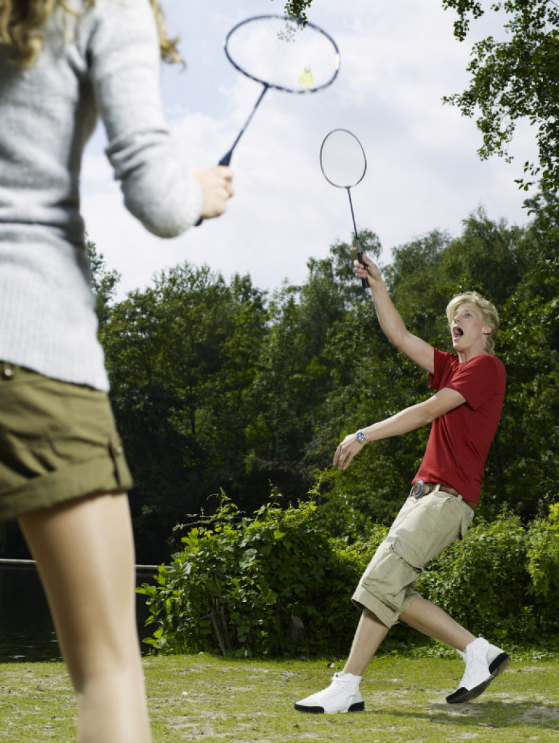 Young Couple Playing Badminton
