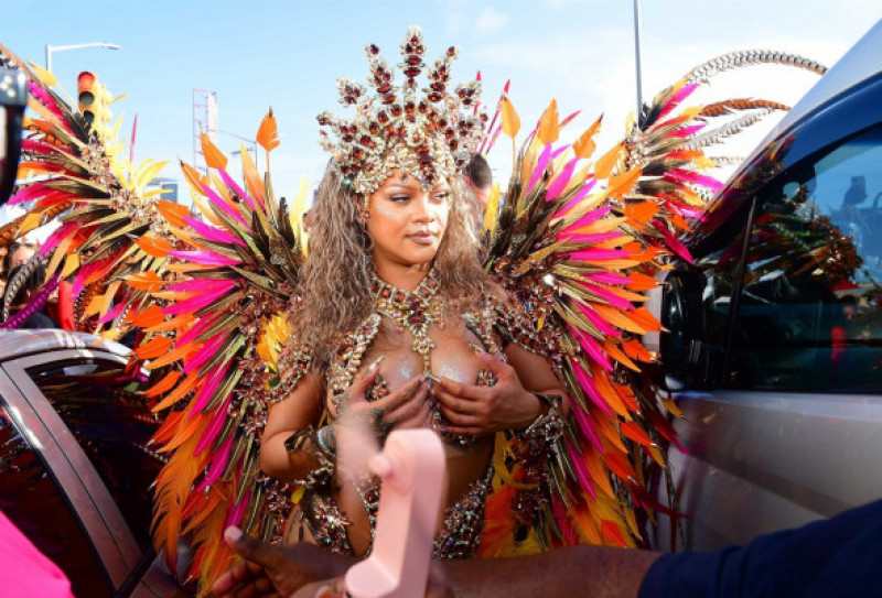 *EXCLUSIVE* Singer Rihanna Stuns at Carnival Festival In Barbados showcasing her 2024 outfit in a bejeweled bikini as she poses with police and fans