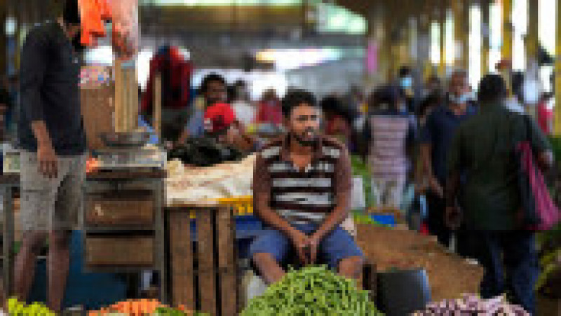 Vânzător de legume într-o piață din Sri Lanka. Sursa foto: Profimedia Images | Poza 22 din 51