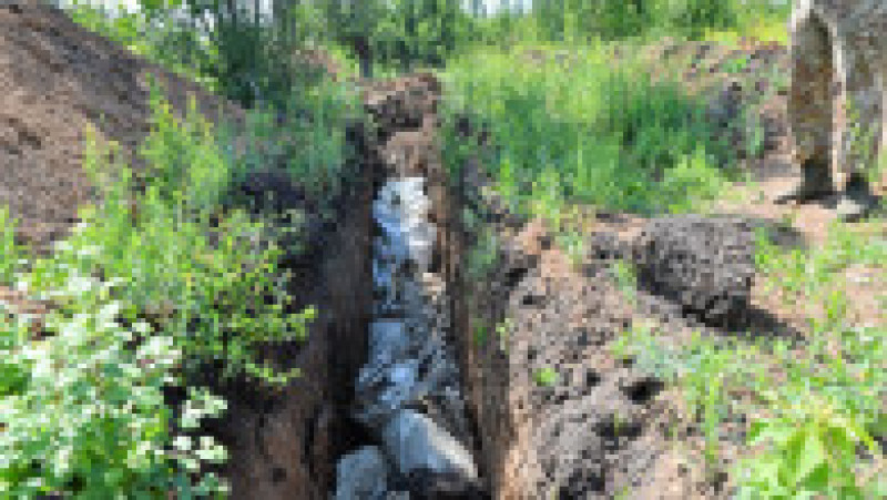 Groapă comună la Lîsîceansk. Foto: Profimedia | Poza 3 din 9