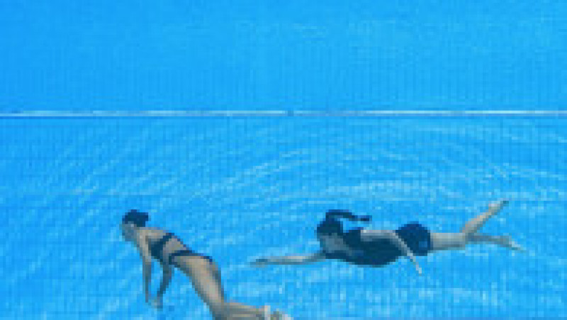 Anita Alvarez nu a mai respirat după finala de la înot artistic solo şi a căzut la fundul bazinului, iar antrenoarea sa a sărit în apă pentru a o salva. Foto: Profimedia Images | Poza 4 din 11