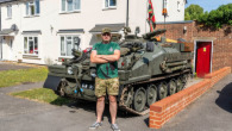 (PICTUREDGary in front of the tank ) Meet the tank-driving dad who gets heads turning as he drives his army tank to the supermarket to do the weekly shop .Gary Freeland, from Amesbury, Wiltshire, entices his kids to help him with the family