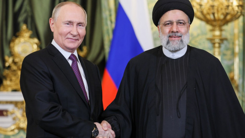 RUSSIA, MOSCOW - DECEMBER 7, 2023: Russia's President Vladimir Putin (L) and Iran's President Ebrahim Raisi shake hands during a meeting at the Moscow Kremlin. Sergei Bobylev/TASS,Image: 827614209, License: Rights-managed, Restrictions: , Model Release: no