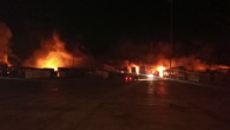 O fotografie a agenției naționale de presă din Siria arată containere care au luat foc în portul Latakia. Foto: Profimedia Images | Poza 6 din 7