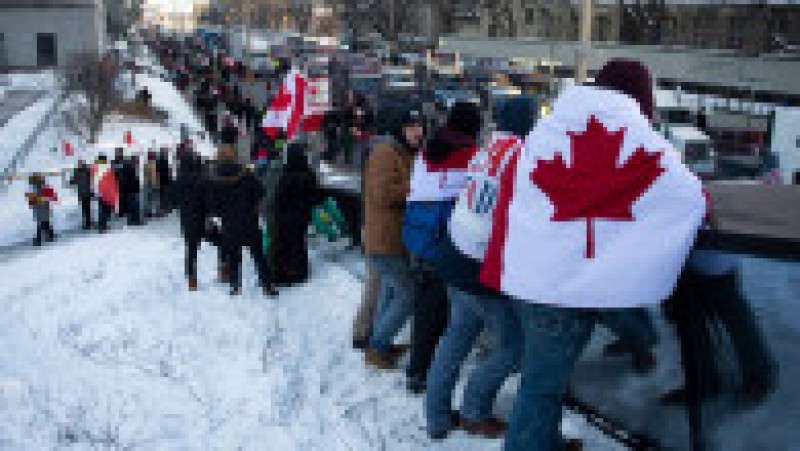 Peste 10.000 de oameni și sute de vehicule, majoritatea camioane, au blocat centrul capitalei federale a Canadei. FOTO: Profimedia Images | Poza 5 din 7