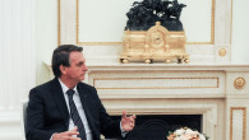 Jair Bolsonaro a stat față în față cu Putin la o masă mică. Foto: Profimedia Images | Poza 2 din 8