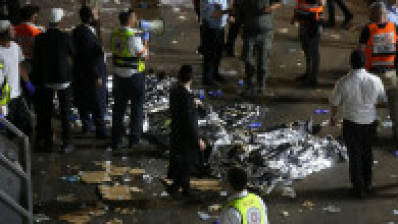 Zeci de morți după ce oamenii s-au călcat în picioare la ieșirea de pe o arenă din Israel. Foto: Profimedia Images | Poza 2 din 5