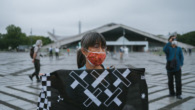 Flacăra olimpică a sosit la Tokyo. Ceremonie discretă și tristă pe un stadion gol și pe o vreme ploioasă. FOTO: Profimedia | Poza 3 din 5