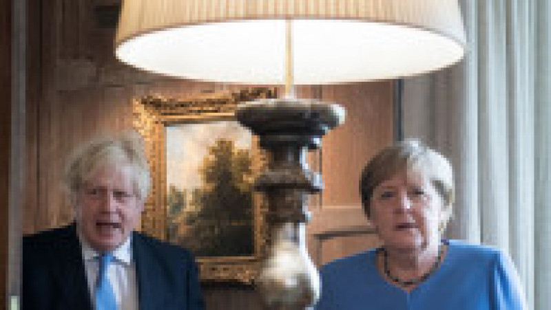 Boris Johnson și Angela Merkel pozează pentru presă înainte de convorbirile bilaterale Foto: Profimedia | Poza 14 din 22