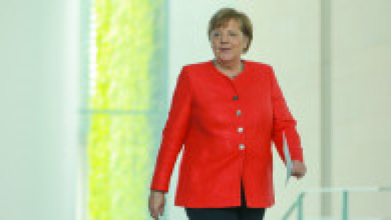 Angela Merkel și-a creat propria uniformă de cancelar: sacoul pătrățos și, de obicei, viu colorat cu pantalon. FOTO: Profimedia Images | Poza 14 din 22