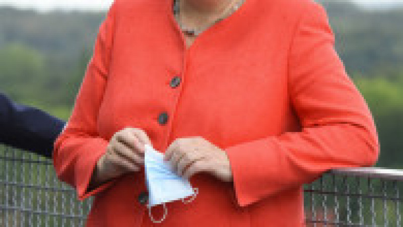 Angela Merkel și-a creat propria uniformă de cancelar: sacoul pătrățos și, de obicei, viu colorat cu pantalon. FOTO: Profimedia Images | Poza 13 din 22