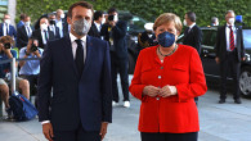 Angela Merkel și-a creat propria uniformă de cancelar: sacoul pătrățos și, de obicei, viu colorat cu pantalon. FOTO: Profimedia Images | Poza 8 din 22