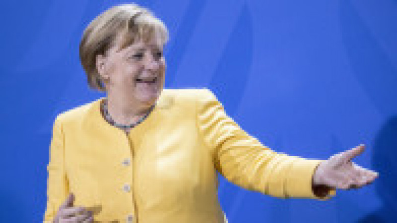 Angela Merkel și-a creat propria uniformă de cancelar: sacoul pătrățos și, de obicei, viu colorat cu pantalon. FOTO: Profimedia Images | Poza 4 din 22