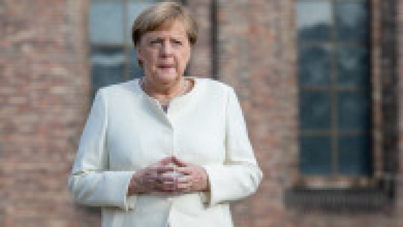 Angela Merkel și-a creat propria uniformă de cancelar: sacoul pătrățos și, de obicei, viu colorat cu pantalon. FOTO: Profimedia Images | Poza 5 din 22