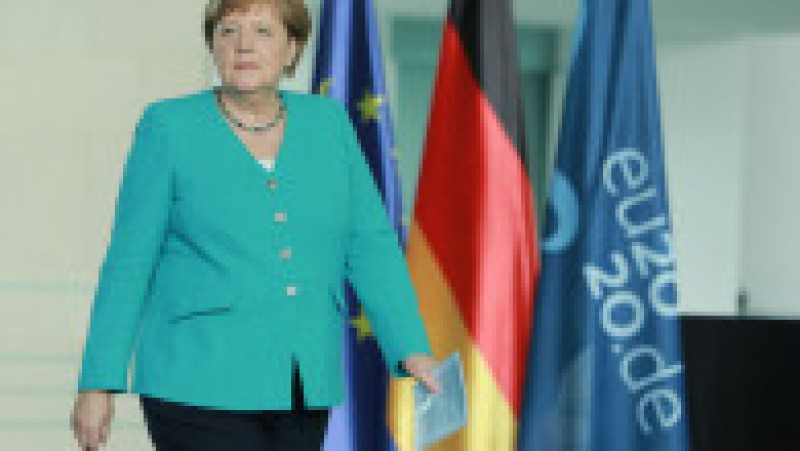 Angela Merkel și-a creat propria uniformă de cancelar: sacoul pătrățos și, de obicei, viu colorat cu pantalon. FOTO: Profimedia Images | Poza 22 din 22
