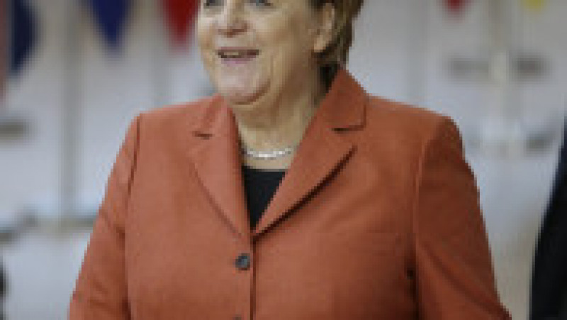 Angela Merkel și-a creat propria uniformă de cancelar: sacoul pătrățos și, de obicei, viu colorat cu pantalon. FOTO: Profimedia Images | Poza 17 din 22