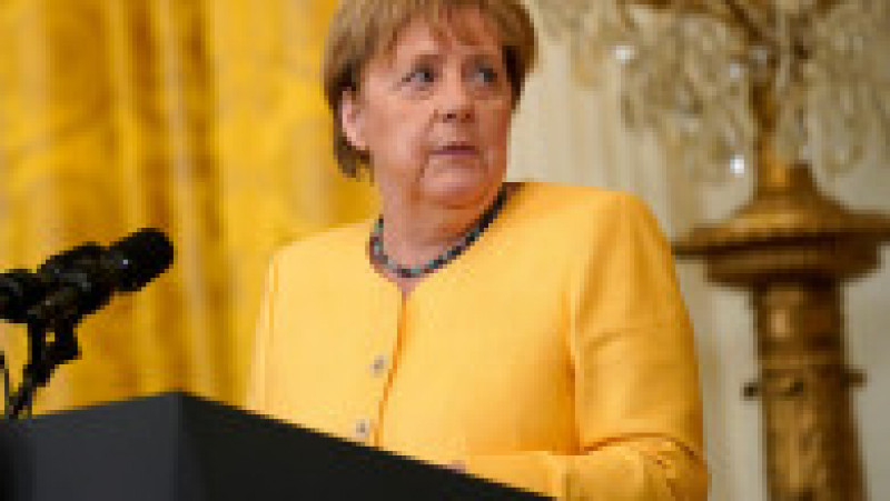 Angela Merkel și-a creat propria uniformă de cancelar: sacoul pătrățos și, de obicei, viu colorat cu pantalon. FOTO: Profimedia Images | Poza 19 din 22