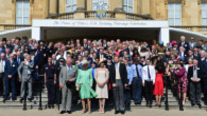 LONDON, ENGLAND - MAY 22: (L-R) Prince Charles, Prince of Wales, Camilla, Duchess of Cornwall, Meghan, Duchess of Sussex and Prince Harry, Duke of Sussex pose with guests as they attend The Prince of Wales