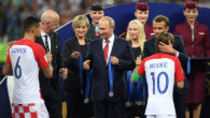 MOSCOW, RUSSIA - JULY 15: President of Russia Valdimir Putin presents Dejan Lovren and Luka Modric of Croatia with their medals next to FIFA president Gianni Infantino and French President Emmanuel Macron following the 2018 FIFA World Cup Final between France and Croatia at Luzhniki Stadium on July 15, 2018 in Moscow, Russia. (Photo by Shaun Botterill/Getty Images) | Poza 8 din 20