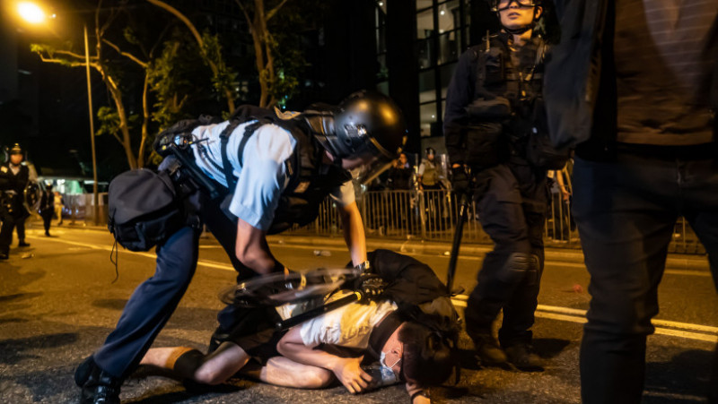 HONG KONG, HONG KONG - JUNE 10: A protester is detained during a clash after a rally against the extradition law proposal at the Central Government Complex on June 10, 2019 in Hong Kong China. Over a million protesters marched in Hong Kong on Sunday against a controversial extradition bill that would allow suspected criminals to be sent to mainland China for trial as tensions escalated in recent weeks.(Photo by Anthony Kwan/Getty Images)