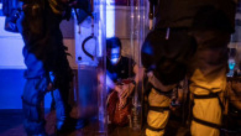 HONG KONG - JUNE 10: A protester is detained during a clash after a rally against the extradition law proposal at the Central Government Complex on June 10, 2019 in Hong Kong. Organizers say more than a million protesters marched on Sunday against a bill that would allow suspected criminals to be sent to mainland China for trial as tensions have escalated in recent weeks. (Photo by Anthony Kwan/Getty Images) | Poza 11 din 15