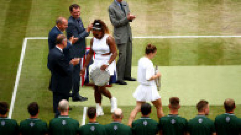 LONDON, ENGLAND - JULY 13: Runner up Serena Williams of The United States receives her trophy following her defeat in in her Ladies