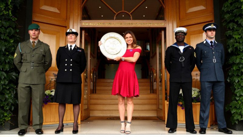 LONDON, ENGLAND - JULY 14: 2019 Ladies' Singles Champion, Simona Halep of Romania poses for a photo with the trophy on the clubhouse steps during Day thirteen of The Championships - Wimbledon 2019 at All England Lawn Tennis and Croquet Club on July 14, 2019 in London, England. (Photo by Clive Brunskill/Getty Images)