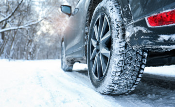 'Winter Car Tire on Snowy Road'