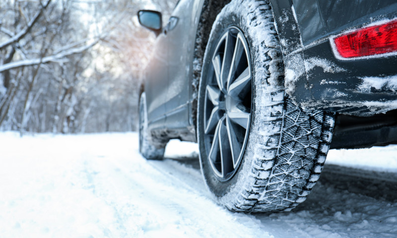 'Winter Car Tire on Snowy Road'